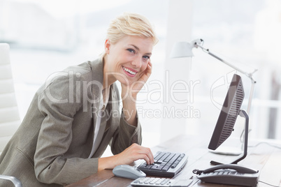 Smiling businesswoman looking at camera