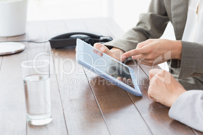 Businesswomen using tablet