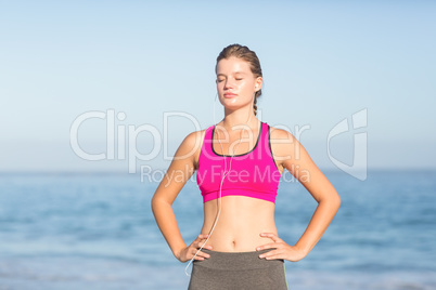 Beautiful fit woman listening music