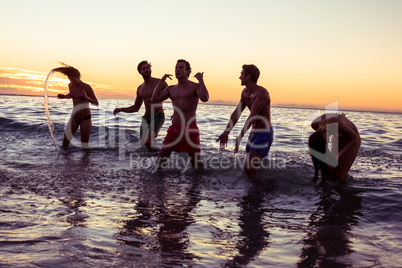 Happy friends having fun in the water