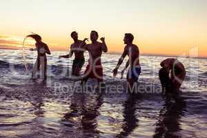 Happy friends having fun in the water