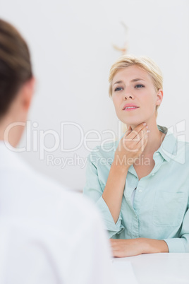 Patient with sore throat visiting doctor
