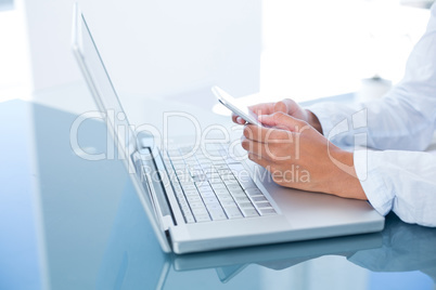 Businesswoman using her smartphone