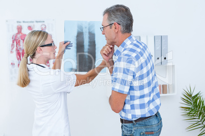 Doctor showing X rays to her patient