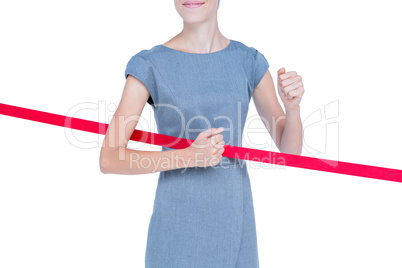 Happy businesswoman cutting red ribbon Happy businesswoman cutting red ribbon