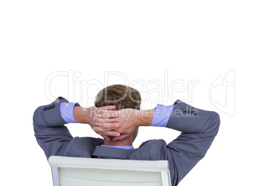 Relaxed businessman extended on a chair
