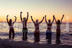 Happy friends having fun in the water