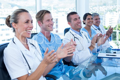 Team of doctors applauding