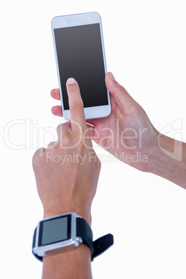 Close up of woman using her smartphone and wearing smartwatch