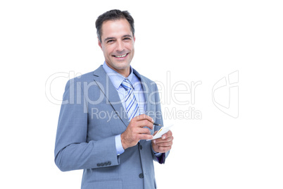 Focused businessman holding notebook