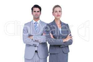 Business people with arms crossed looking at camera