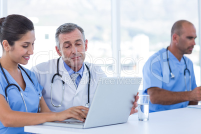 Doctors using computer