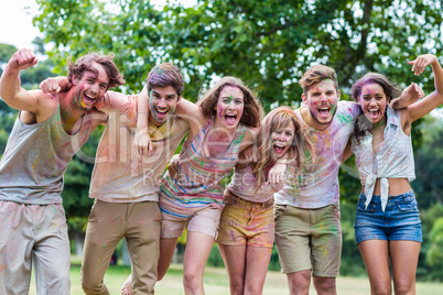 Happy friends covered in powder paint