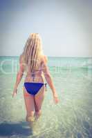 Rear view of beautiful blonde woman on a sunny day