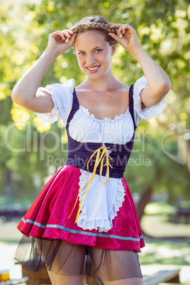 Pretty oktoberfest blonde smiling in the park