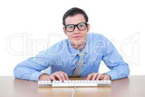 Businessman typing at his desk