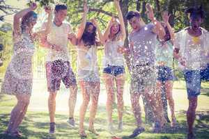 Happy friends jumping in the water shoot