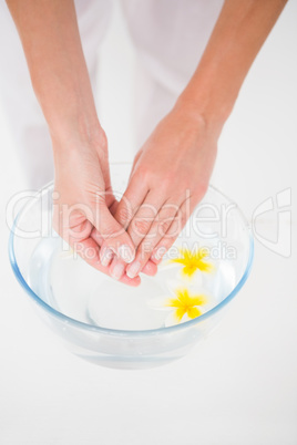 Woman making a hand treatment in a bowl