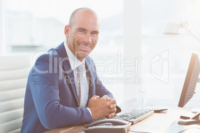 Smiling businessman looking at camera