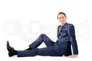 Businessman looking at camera on the floor