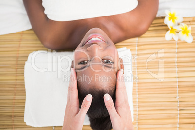 Pretty woman enjoying a head massage