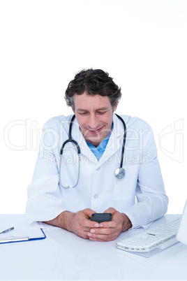 Smiling doctor texting in the office