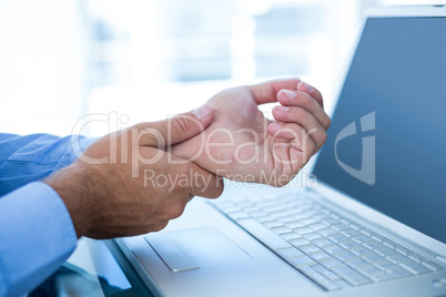 Businessman holding his hand