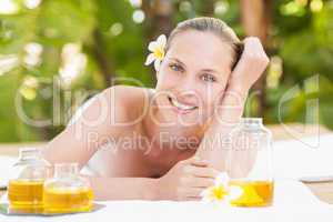 Peaceful blonde lying on towel