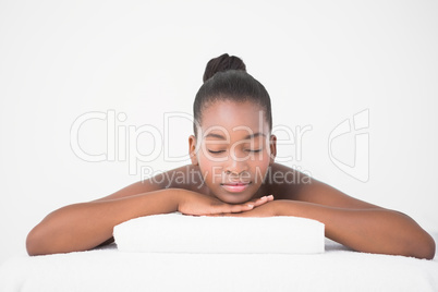 Peaceful pretty woman lying on massage table