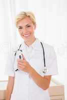 Portrait of a smiling blonde doctor with stethoscope