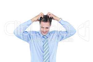 Anxious businessman with hands on his head