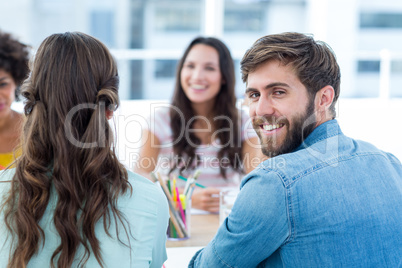 Cheerful creative business team in meeting