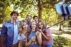 Happy friends in the park taking selfie