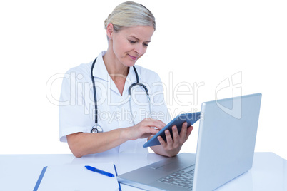 A doctor using tablet in the office