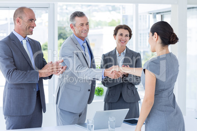 Interview panel shaking hands with applicant