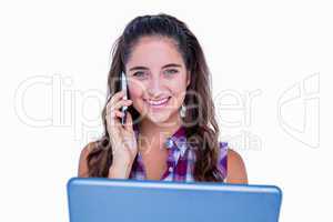 Happy pretty brunette using tablet computer and having phone cal