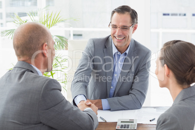 Businessman shaking hands with a co worker