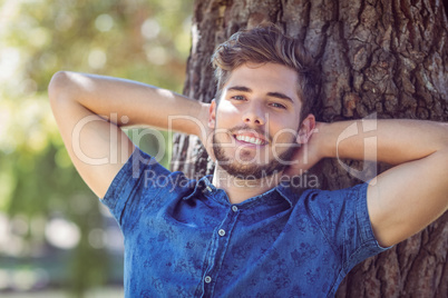 Handsome hipster smiling at camera