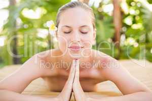 Peaceful blonde lying on massage table