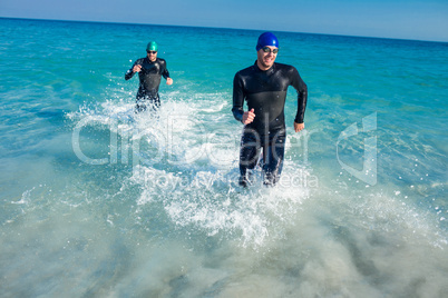 Swimmers running in the ocean