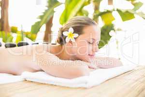 Peaceful blonde lying on towel