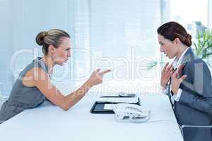 Businesswoman yelling at colleague