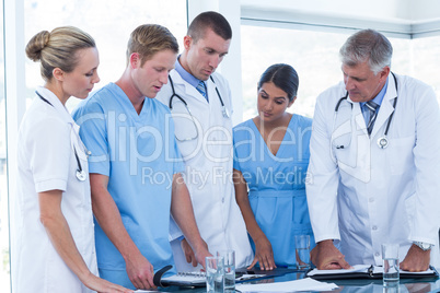 Team of doctors looking at their diaries