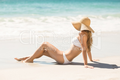 Blonde woman looking at the sea