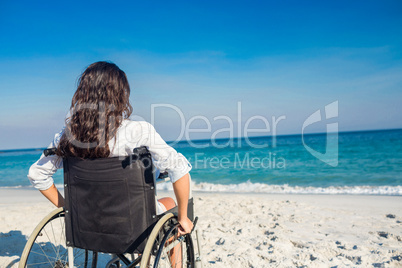 Disabled woman looking at the ocean
