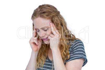 A blonde woman having headache