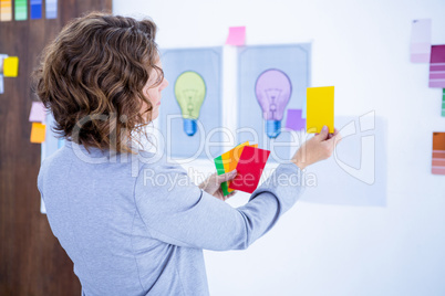 Creative businesswoman holding color cards