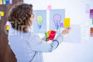 Creative businesswoman holding color cards