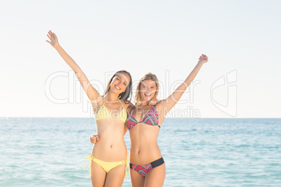 Happy friends having fun beside the water