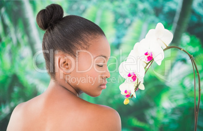 Close up of a beautiful young woman holding flower